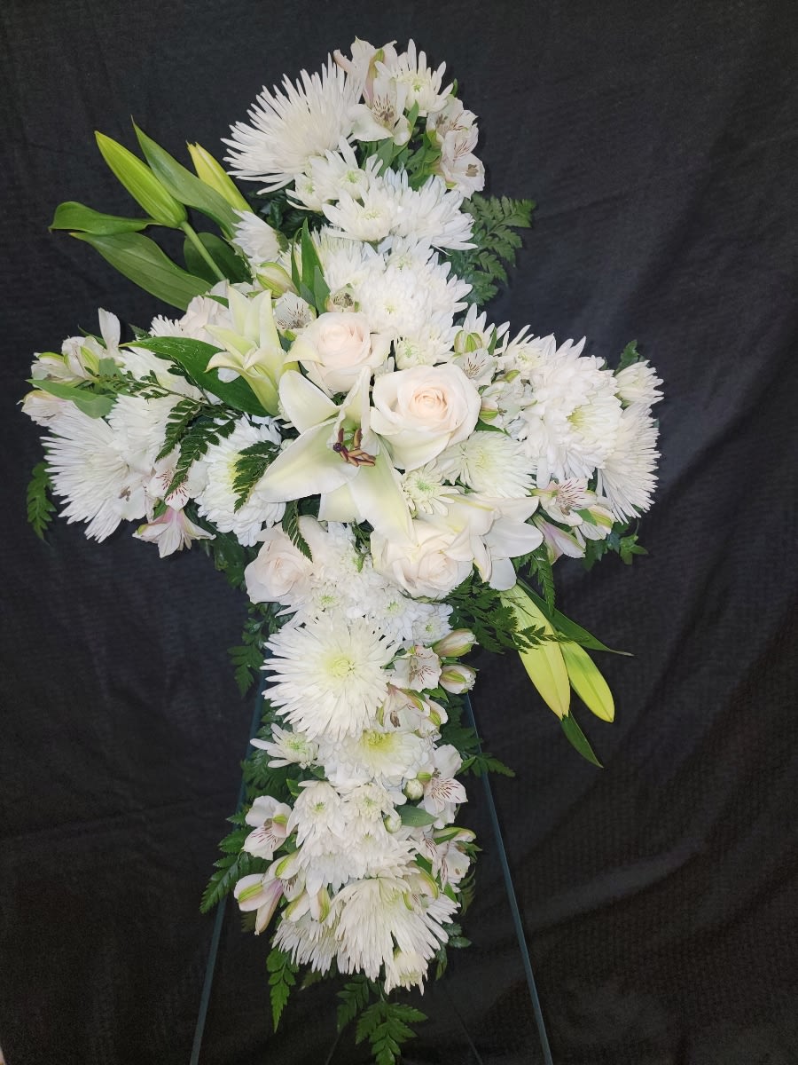 Divine Light Divine Light - Sympathy arrangements please call us right away for delivery to Memorials or Funeral Homes. 520-568-4600 Your message of hope for eternal serenity is delivered ever so elegantly in this graceful cross. Your sincerity will be acknowledged by all who are present. A cross that is a beautiful way to honor a loved one.