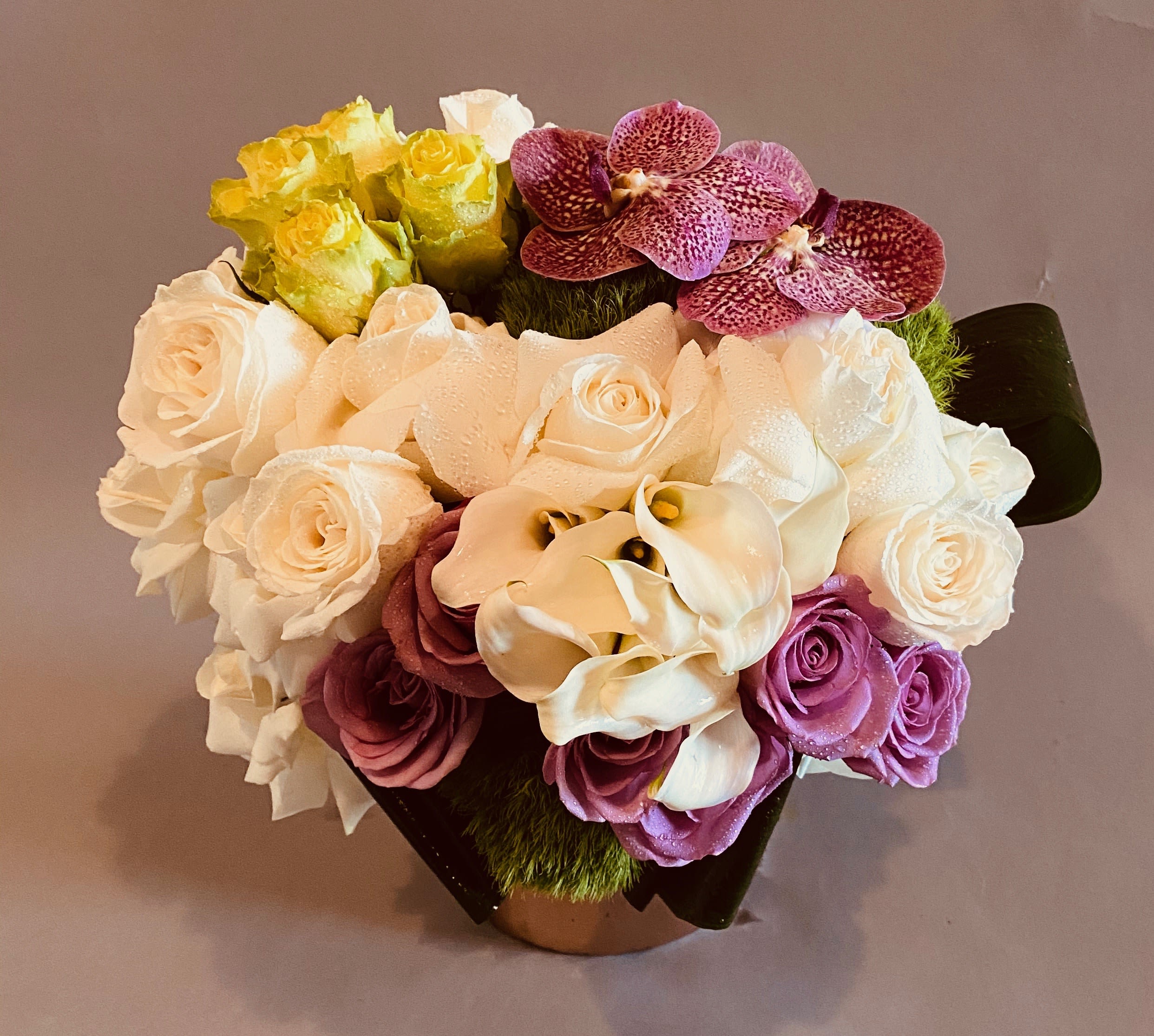 Summer Time - A modern arrangement of calla lillies, roses, and 