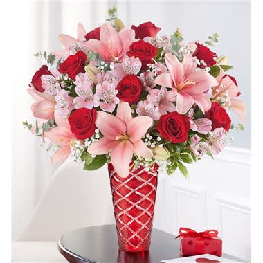 Key To My Heart Key To My Heart - The key to an unforgettable Valentine’s. Red & pink blooms are arranged in our luxurious ruby red vase. Featuring diamond cuts that brilliantly catch the light, it’s a gift that delivers on sparkle and elegance. All-around arrangement with red roses; pink Asiatic lilies and Peruvian lilies (alstroemeria); accented with baby’s breath, spiral eucalyptus and assorted greenery