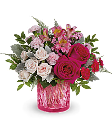 Vintage Elegance Vintage Elegance - Take their Valentine's Day breath away with this stylish pink rose bouquet, presented in an artisanal mosaic vase of stained glass that swirls in stunning shades of pink. Hot pink roses, light pink spray roses, miniature pink carnations and dark pink alstroemeria are arranged with pink sinuata statice, leatherleaf fern, huckleberry and dusty miller. Delivered in Teleflora's Precious in Pink cylinder.