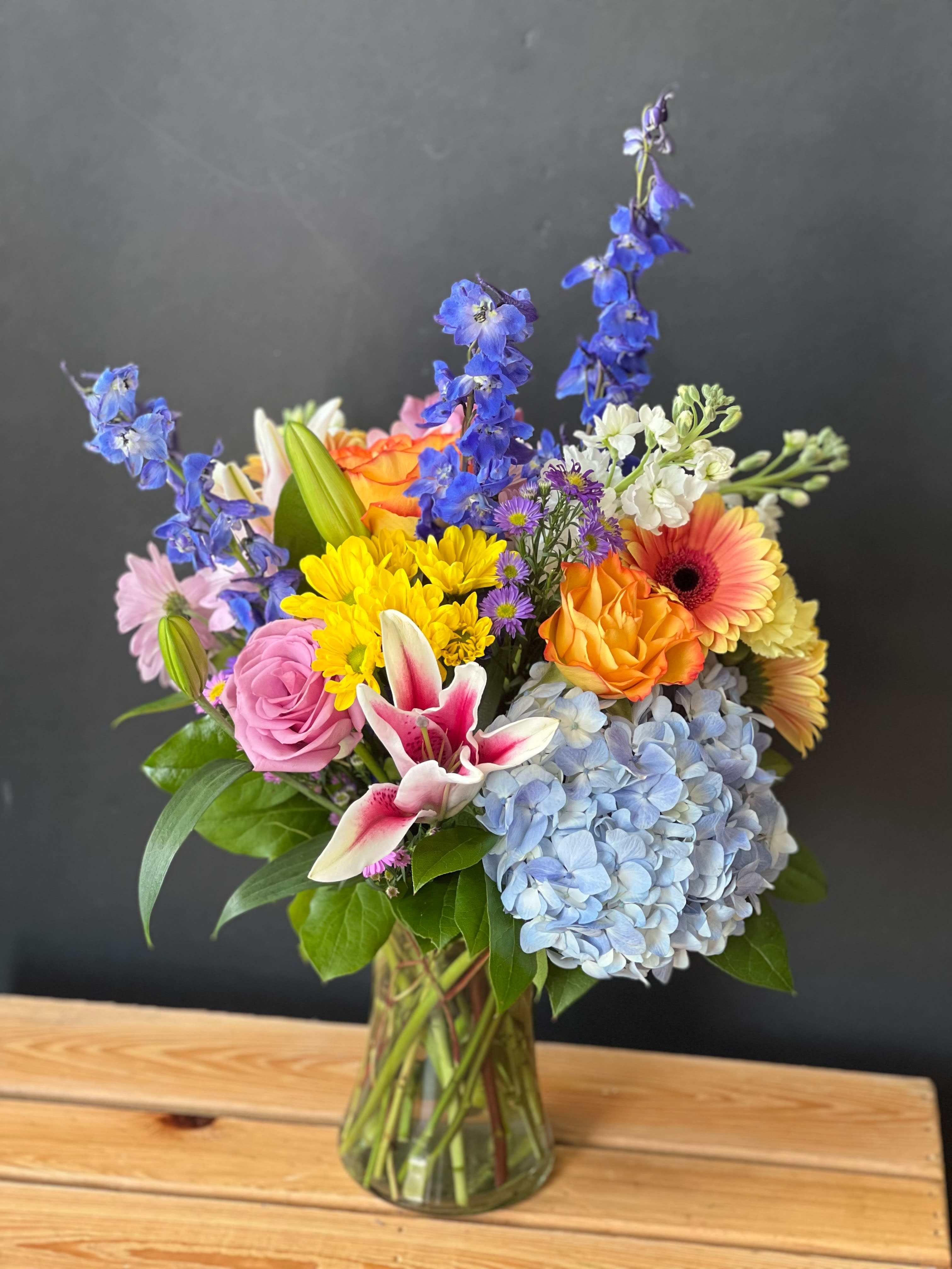 Hydrangeas and More - Cylinder vase designed with hydrangeas and mixed flowers.