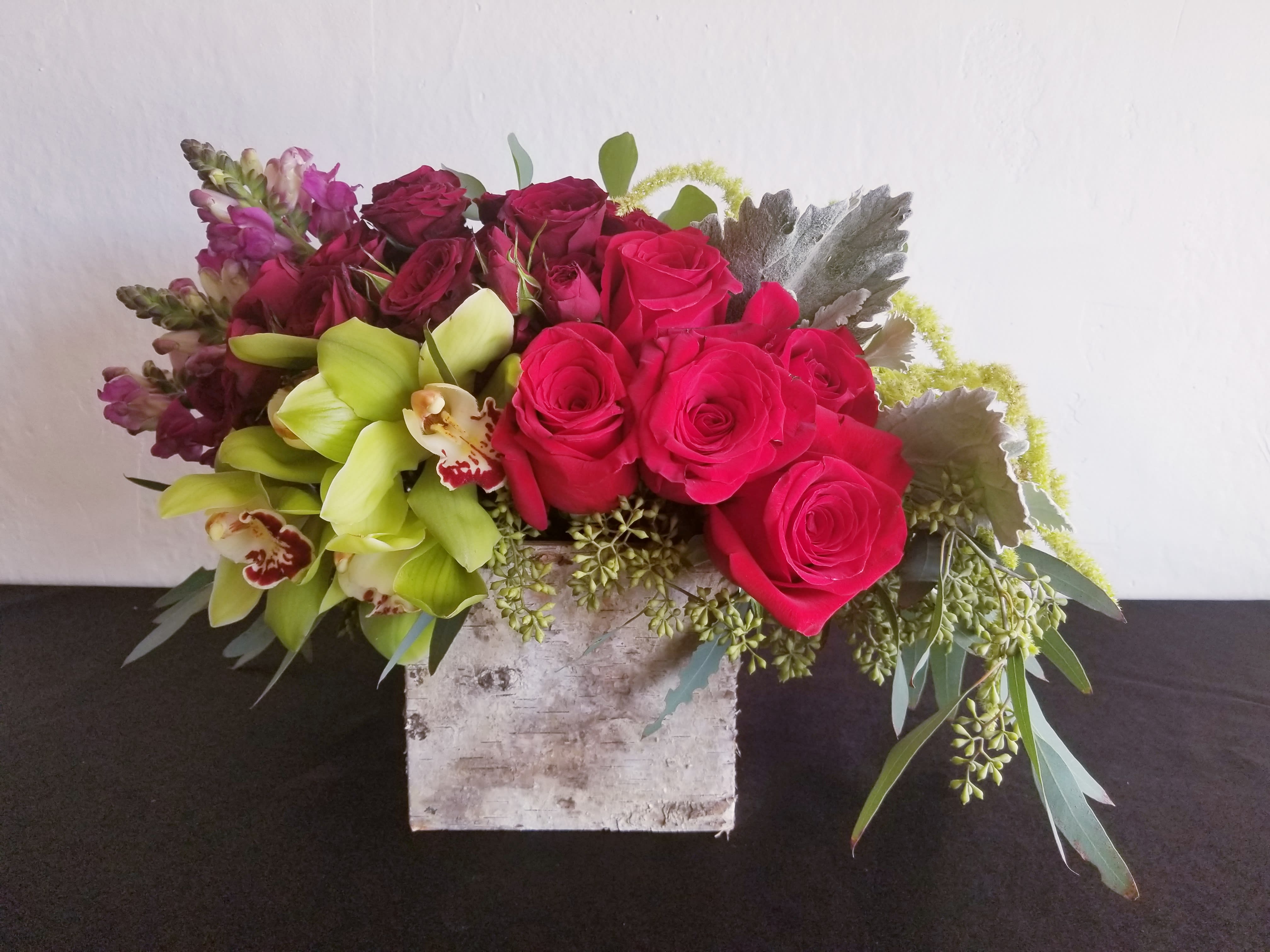 True Love - Composed of Roses, orchids, amaranth, snapdragons, greenery.