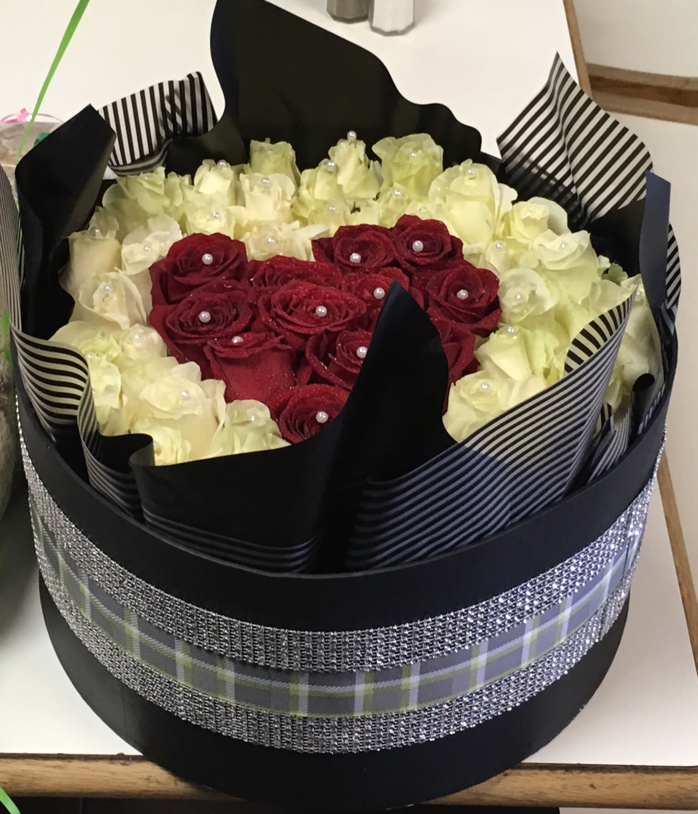 BE MINE - 50-100 roses in  any color in a decorative hat box. You can custom design this. Just tell us what you want.