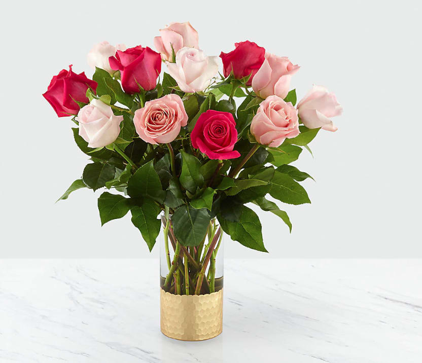 Love &amp; Roses™ Bouquet - The gorgeous simplicity of roses is what makes our Love and Roses Bouquet a classic favorite for Valentine's Day. From the delightful hues of pale pink, pink and hot pink roses to the clear glass vase with gold honeycomb base, this arrangement shares every message of true love to the ones you care for the most. GOOD bouquet is approx. 19&quot;H x 18&quot;W. BETTER bouquet is approx. 21&quot;H x 20&quot;W. STANDARD IS A DOZEN ROSES DELUXE IS 24 ROSES   
