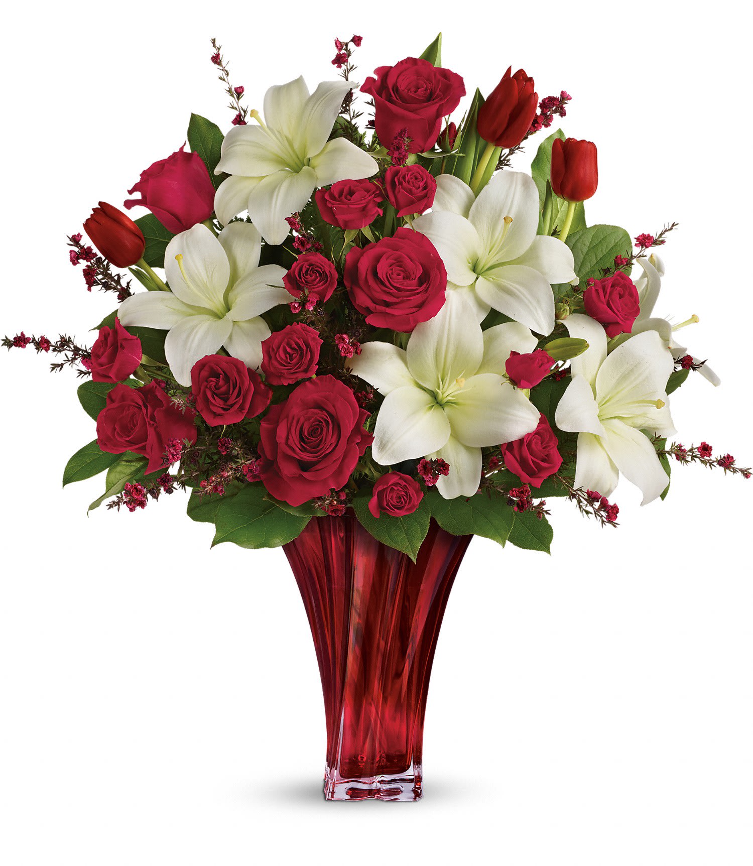 Love's Passion Bouquet by Teleflora DX Love's Passion Bouquet by Teleflora DX - Classic romance is this radiant bouquet of red roses, crimson tulips and pure white lilies, hand-delivered on Valentine's Day or any day in an exquisite blown glass vase. With its radiant red hue and unique twisting shape, it's sure to take their breath away!