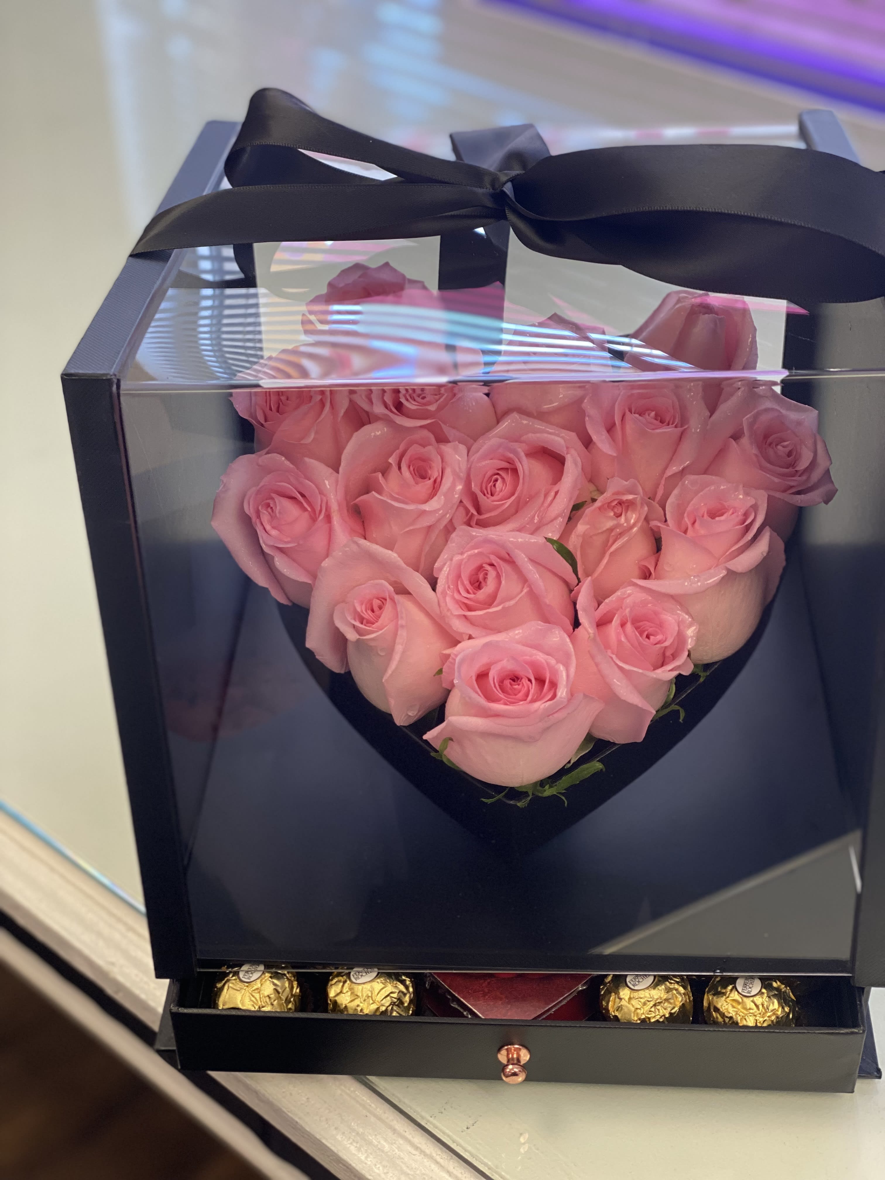 The best valentines  - A lush gift box with a hear shape filled with roses, and a box with candy