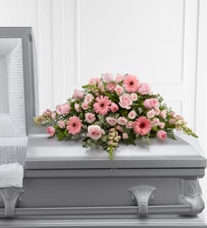  The FTD® Sweet Farewell™ Casket Spray   S24-4490  - The FTD® Sweet Farewell™ Casket Spray exudes an atmosphere of grace and soft serenity to commemorate a life lived with warmth and caring kindness. Blushing pink roses, gerbera daisies, spray roses, tulips and snapdragons are offset by a variety of lush greens and lovingly arranged to create a stunning accent piece intended to adorn the top of their casket at their memorial service.  DUE TO THE NATURE OF THIS ARRANGEMENT, A MINIMUM NOTICE OF 72 BUSINESS HOURS MAY BE REQUIRED.