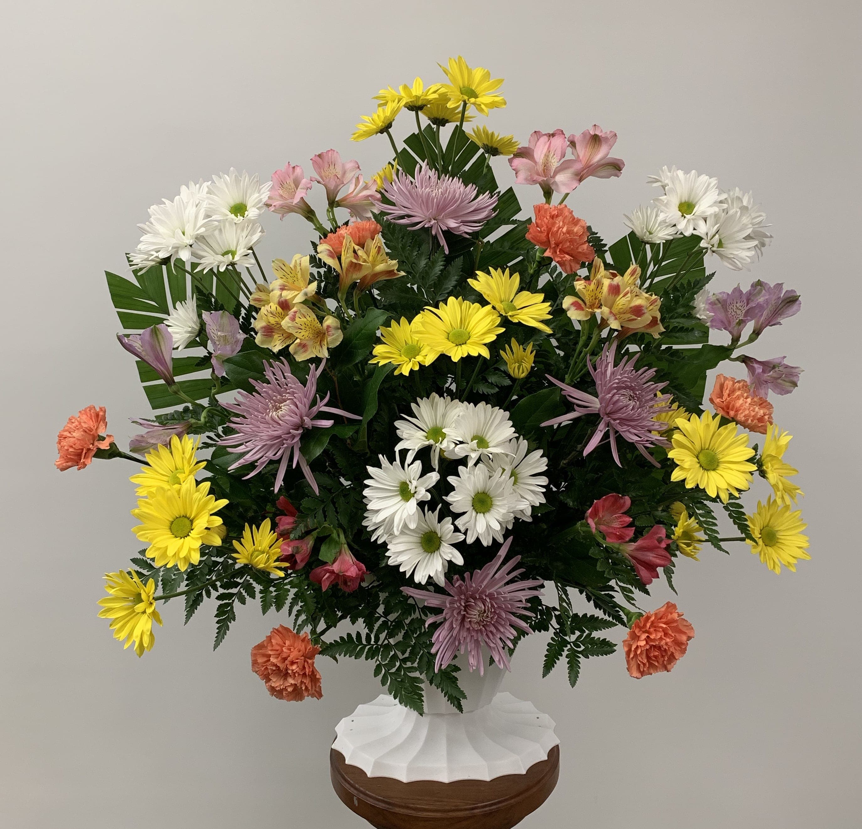 Summer's Light - Traditional floral offering of mixed flowers in bright colors.
