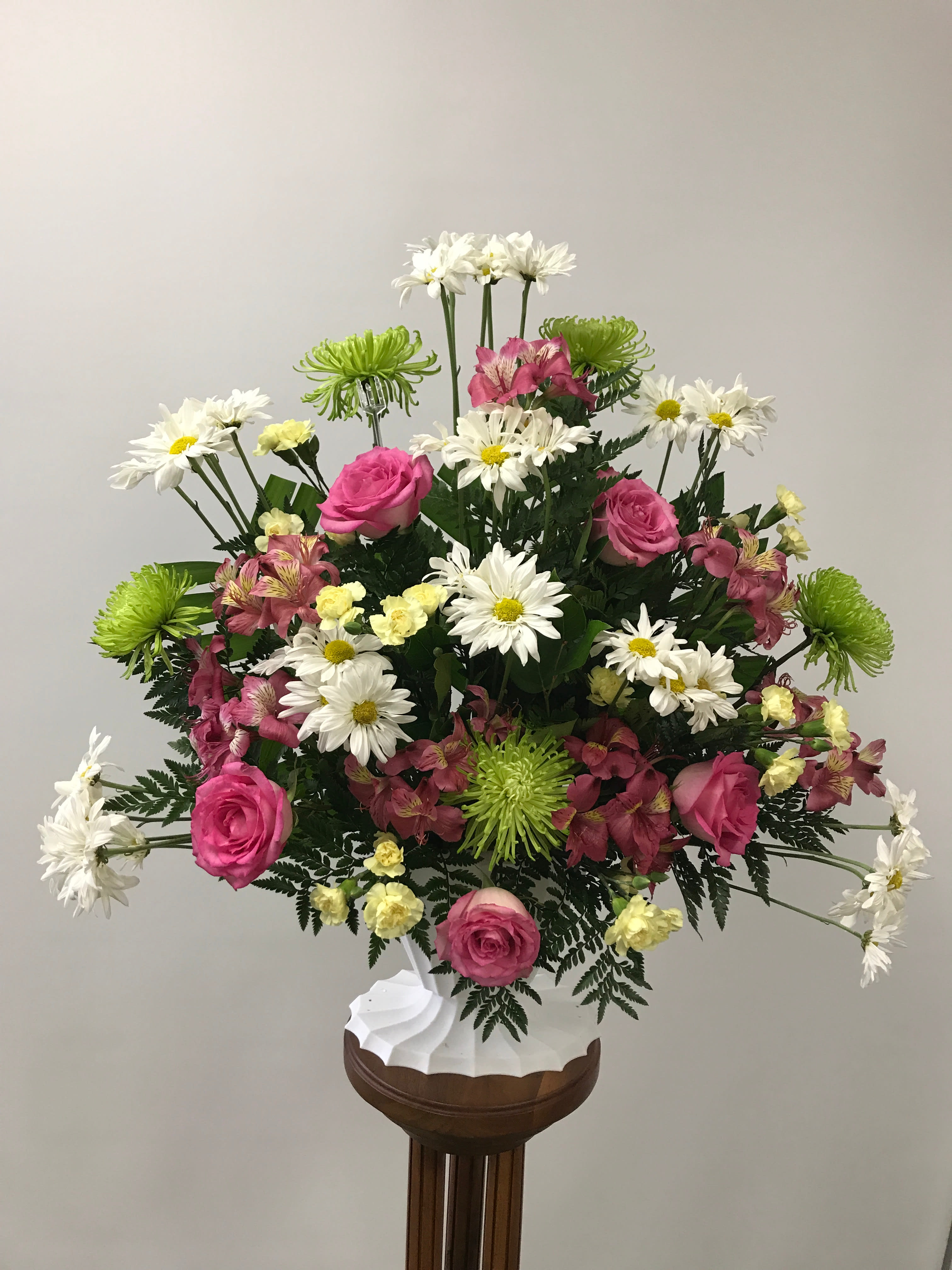  Adoring Heart - Share your heartfelt feelings on the loss of someone special with this feminine arrangement of pink roses and alstroemeria, white daisies. green chrysanthemums, and yellow carnations.  Orientation: One-Sided  