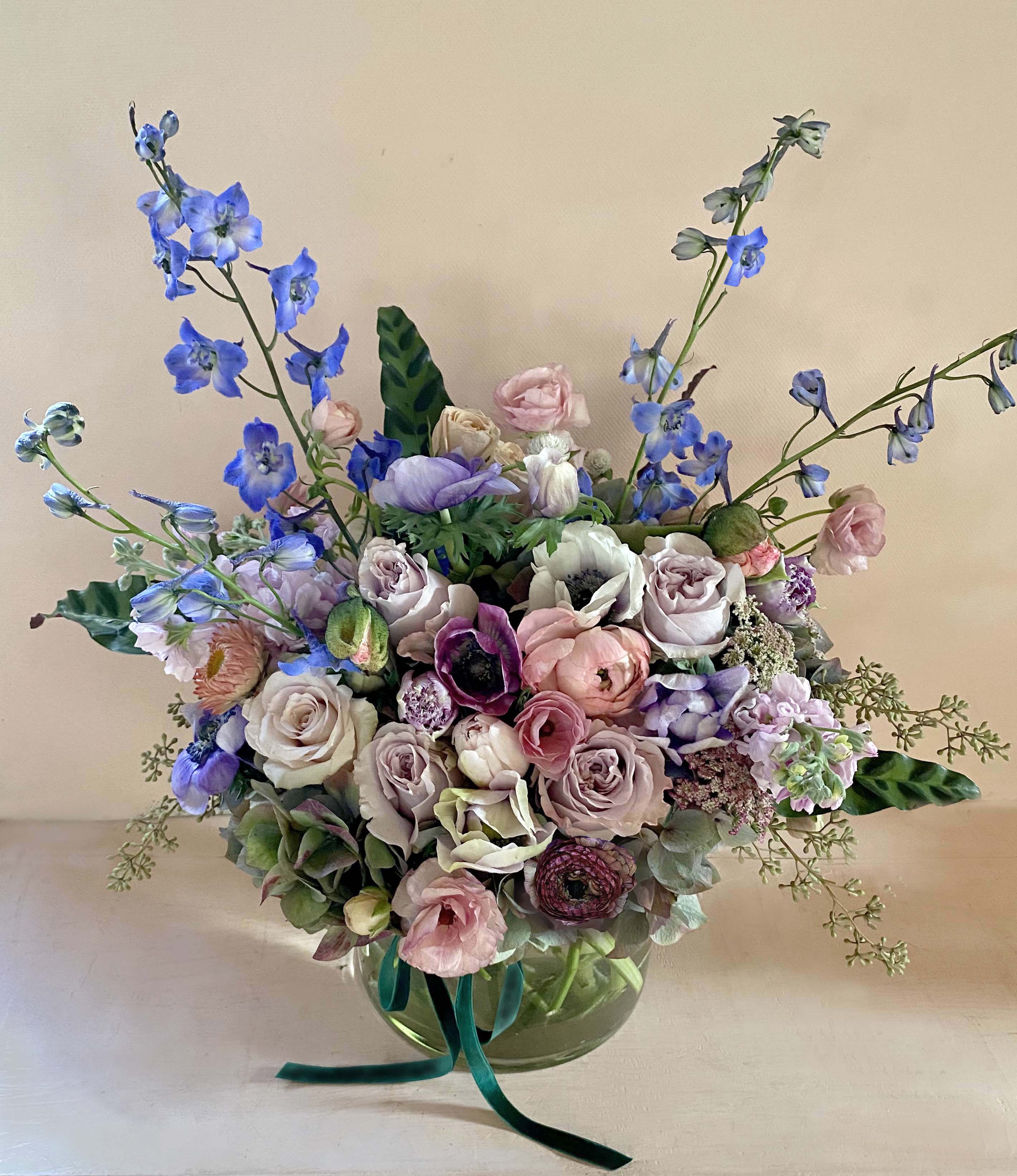 Benedict Canyon arrangement Benedict Canyon arrangement - "Deep greens and blues are the colors I choose..." Gorgeous lush arrangement for the gent or the lady, for anyone who deserves some xtra attention, for a celebration or for your dinner table. All high quality flowers hand picked by Blomst in the stunning color palette of green, blue, sand/grey, purple and with hints of coral.