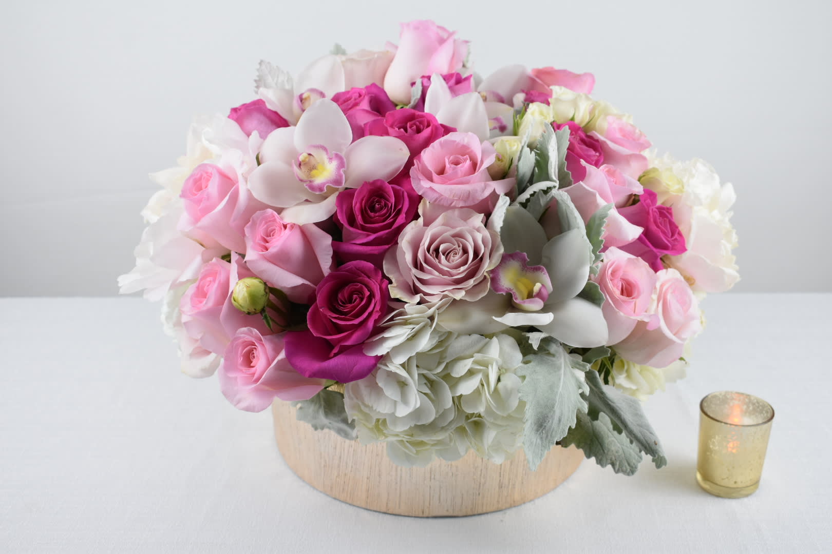 Pinks Pinks Pinks.... - This beautiful arrangements comes in a round Gold low vase  With some lovely white hydrangeas, shades of pink Ecuadorian roses, Light pink peonies, white spray roses, white cymbidium orchids with just the perfect touch of dusty miller