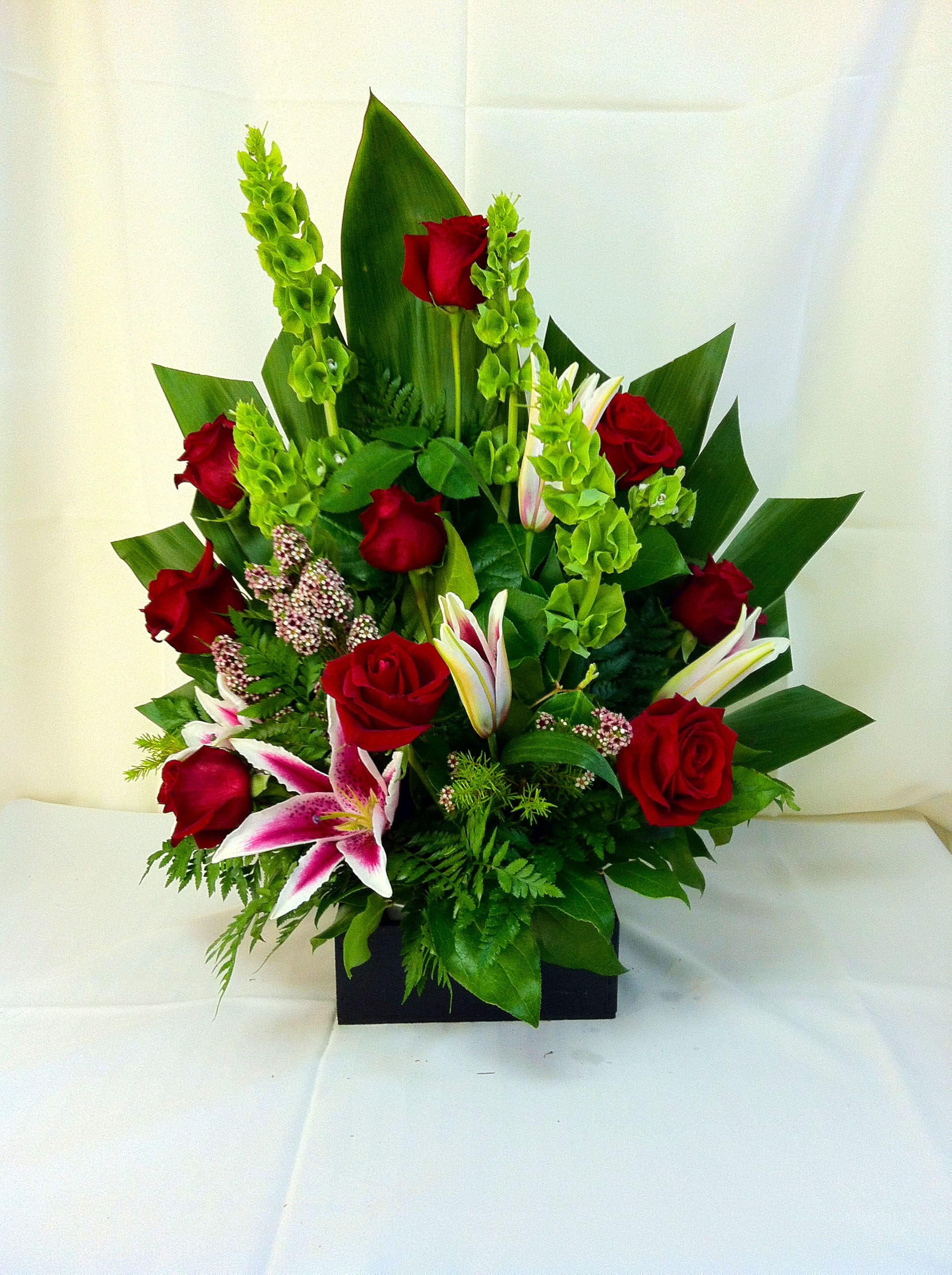 Irish Reds - Our freshest collection of 'Stargazer' lilies, bells of Ireland, Red Roses and more. Simply heavenly!