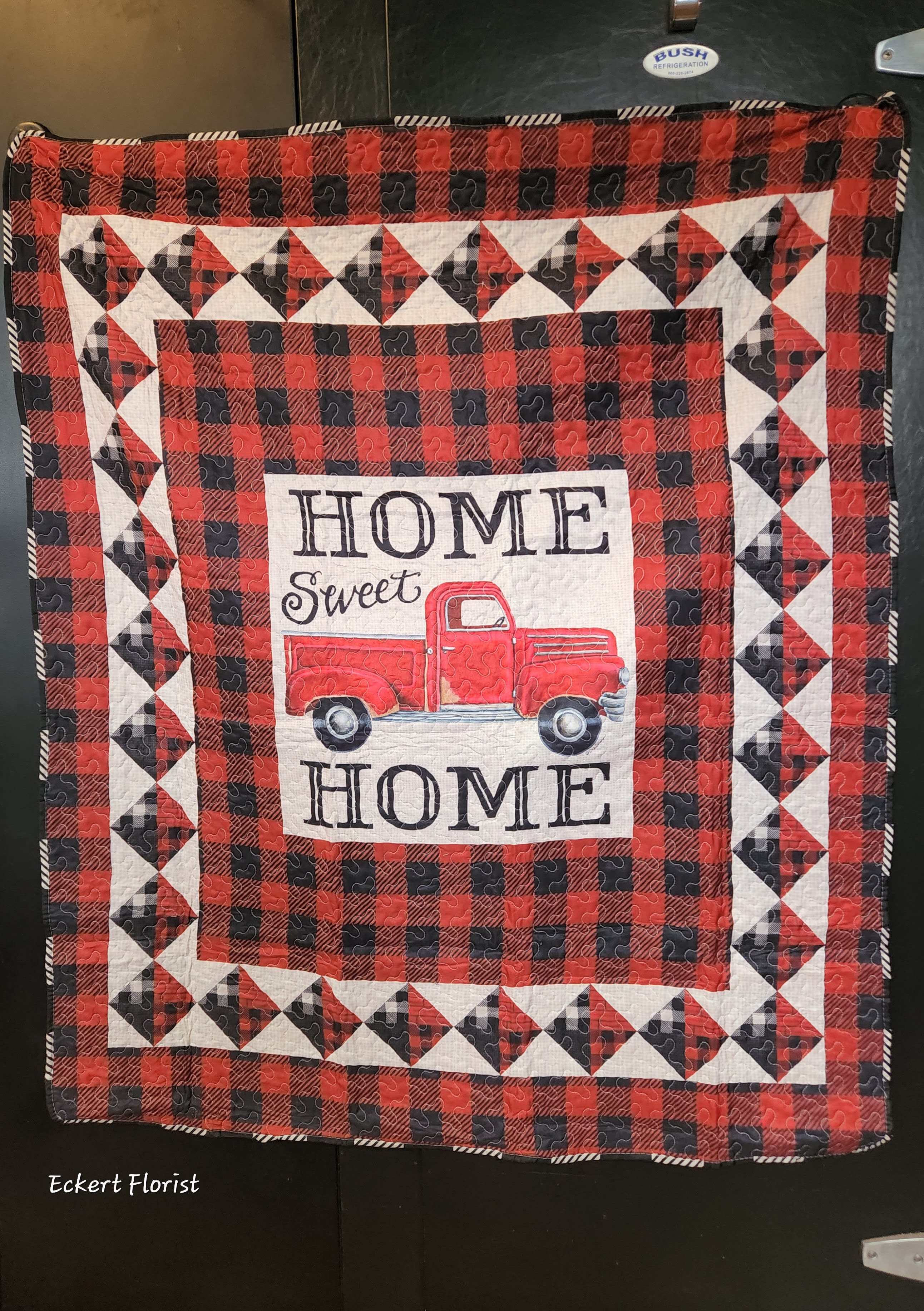Eckert Florist's Home Sweet Home Red Truck Quilted Throw - Home Sweet Home Red Truck Reversible Soft Quilted Throw Blanket 50x60 inch. Back side is black and white buffalo print. *OUR LOCAL DELIVERY ONLY