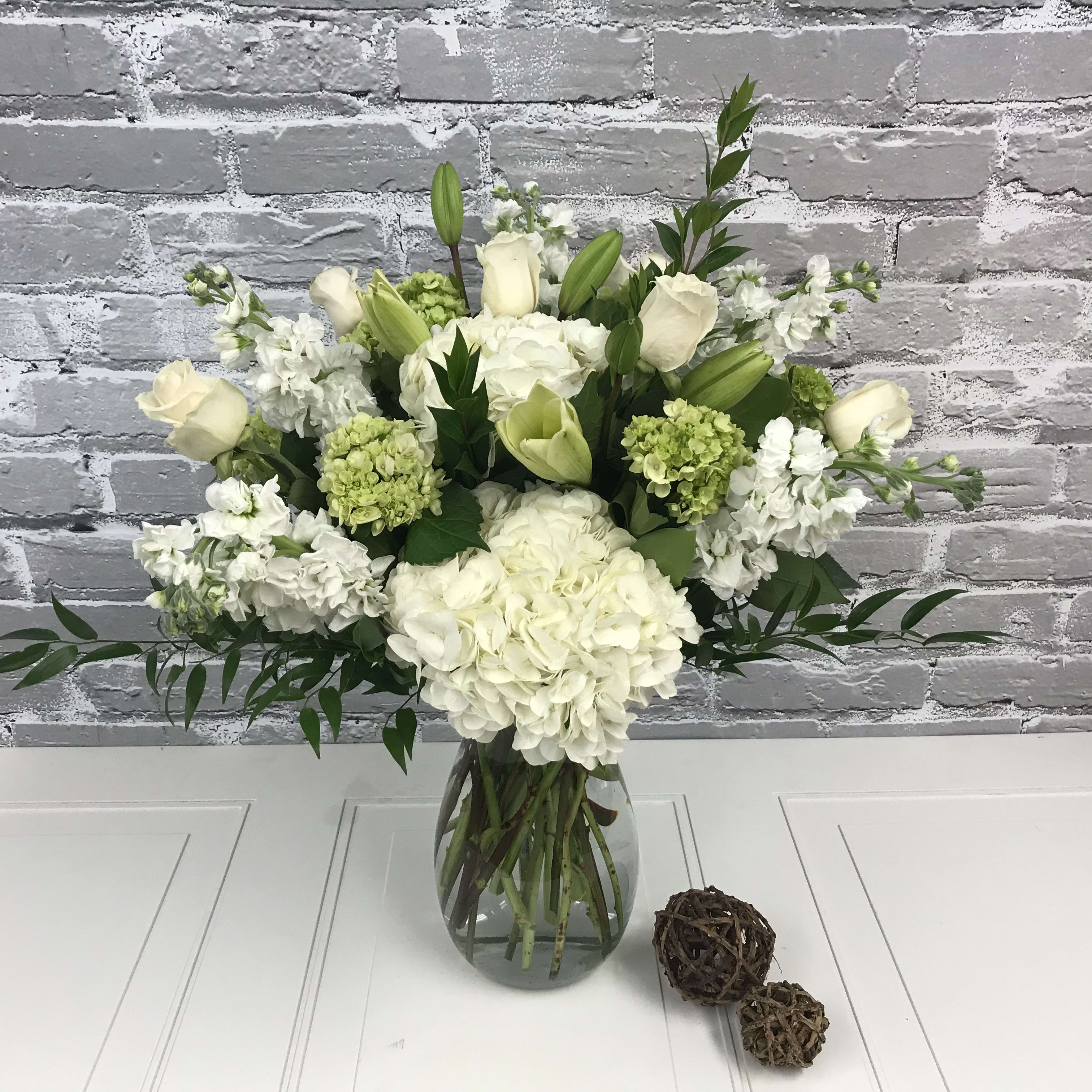 Peaceful - Grand vase with white and green hydrangeas, roses, stock (or snapdragons) and white lilies. Truly gorgeous. 