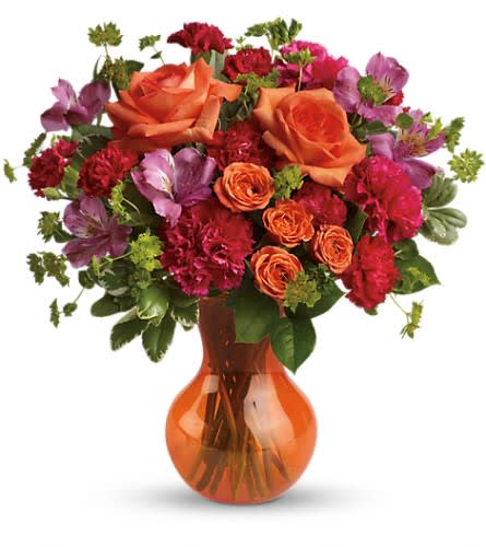 Teleflora's Fancy Free Bouquet - At once bold and delicate this gorgeous gathering of pink and orange blooms is a fabulous way to fancy up her day. Delivered in a Serendipity vase. Approximately 14 3/4&quot; W x 15&quot; H Orientation: One-Sided As Shown : TEV32-2ADeluxe : TEV32-2BPremium : TEV32-2C