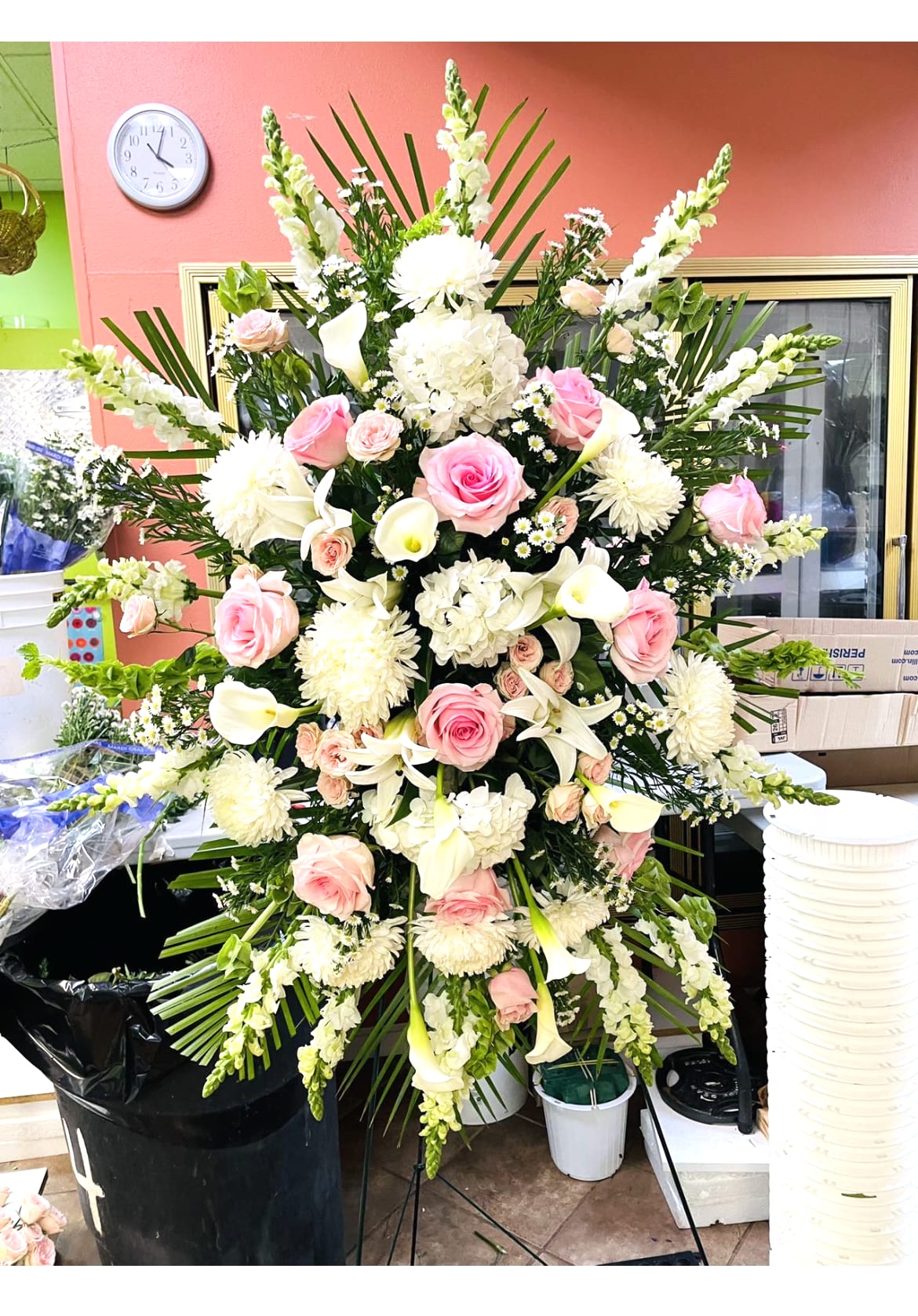 • Funeral Wreath • White Roses • Blue Delphinium • White Mums • White Daisies • White Carnations • Blue Ribbon • Personal Card Message - The Serene Sympathy Wreath is a beautiful way to celebrate the memory of a loved one. This stunning memorial wreath is created by one of our local florist partners using the freshest seasonal flowers. White blooms such as roses, daisies, carnations, and mums with blue delphinium in the shape of a wreath will express your sympathy for the loss of a friend or loved one. 
