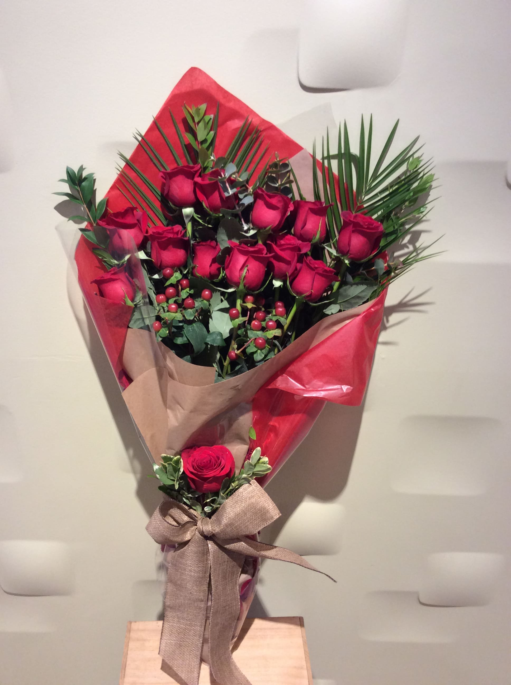 Dozen Red Roses Wrap Bouquet by Downtown Flowers