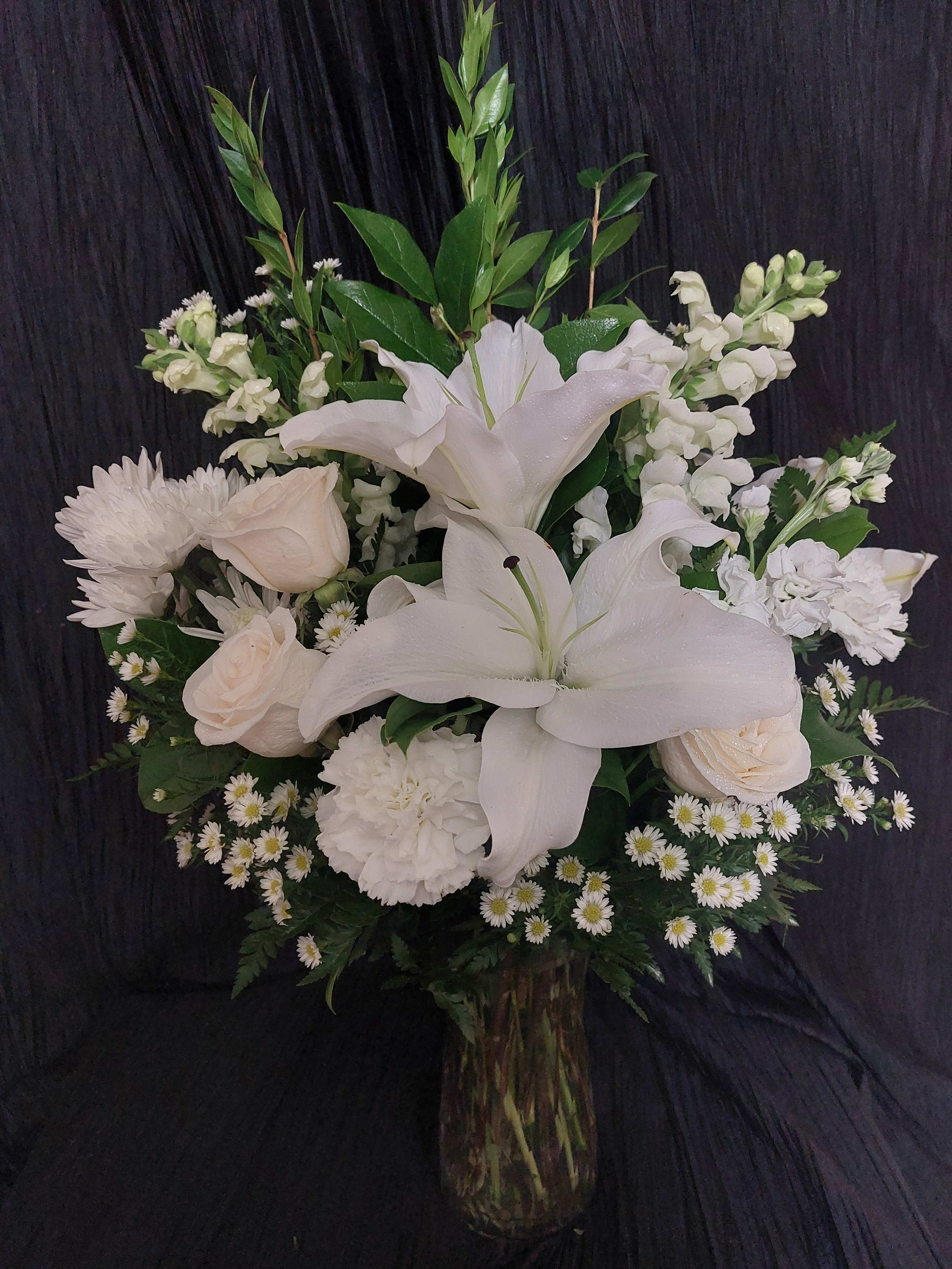 Beautiful in White Beautiful in White - Vase arrangement filled with array of white flowers and assorted foliage