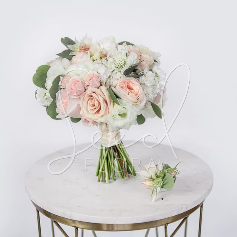 Making It Official  - Pair it up with our effortless custom bouquet + boutonniere. Colors subject to change dependent on wedding color palette. Featuring: Roses, Scabiosa, Lisianthus &amp; Protea.