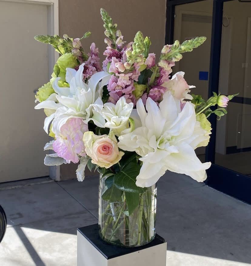 Soft Palette  - A simple and sweet arrangement with lilies, snap dragons, roses, dahlias, and lisianthus. Clear glass vase provided. 