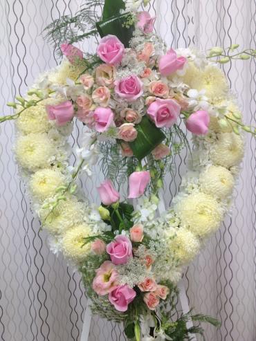 Heart Wreath Heart Wreath - China mums, roses and orchids make up this standing heart wreath.