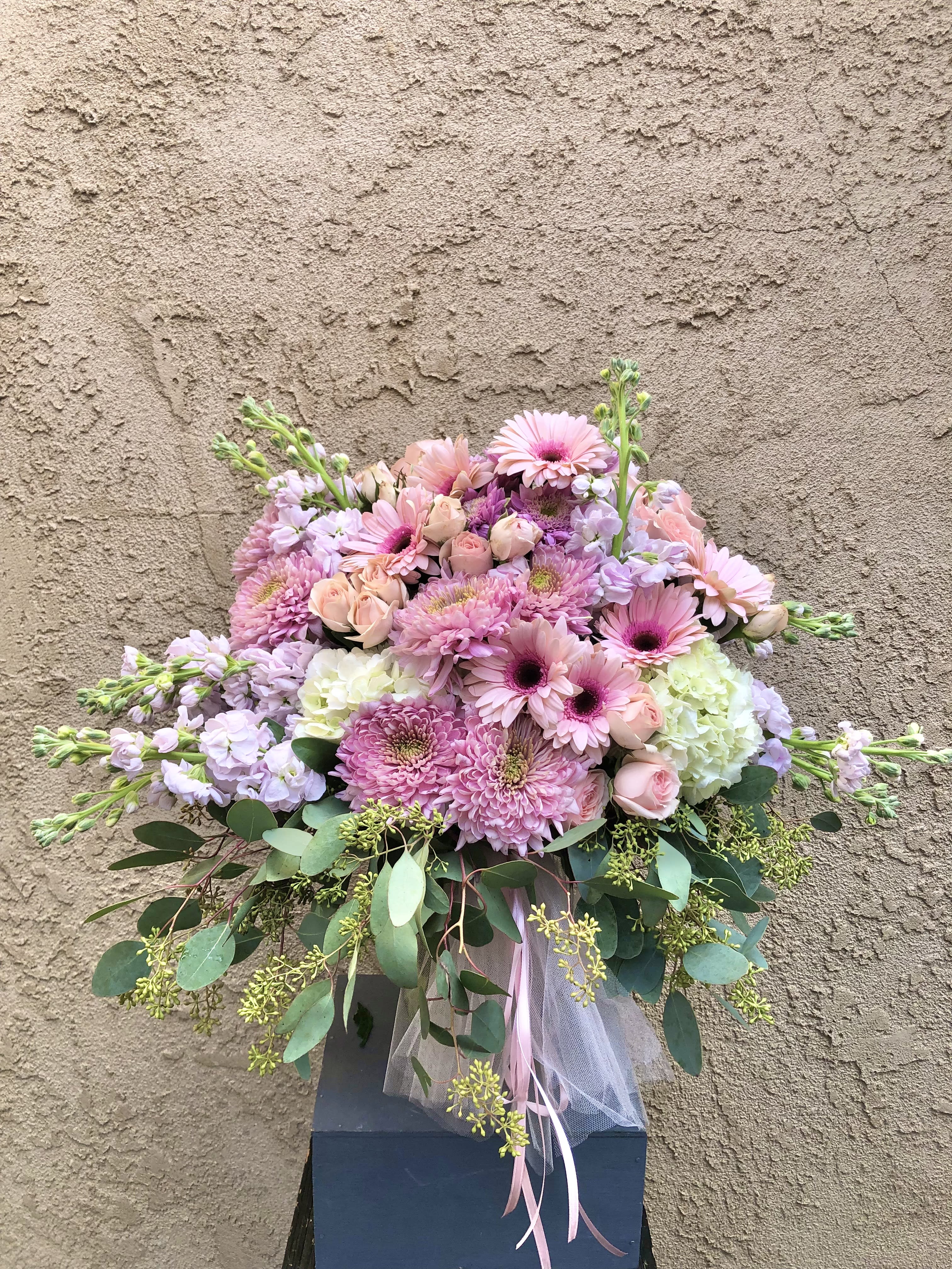 She is Grace - Beautiful arrangement featuring dahlia, daisies, roses, stock, hydrangeas, and green accents.