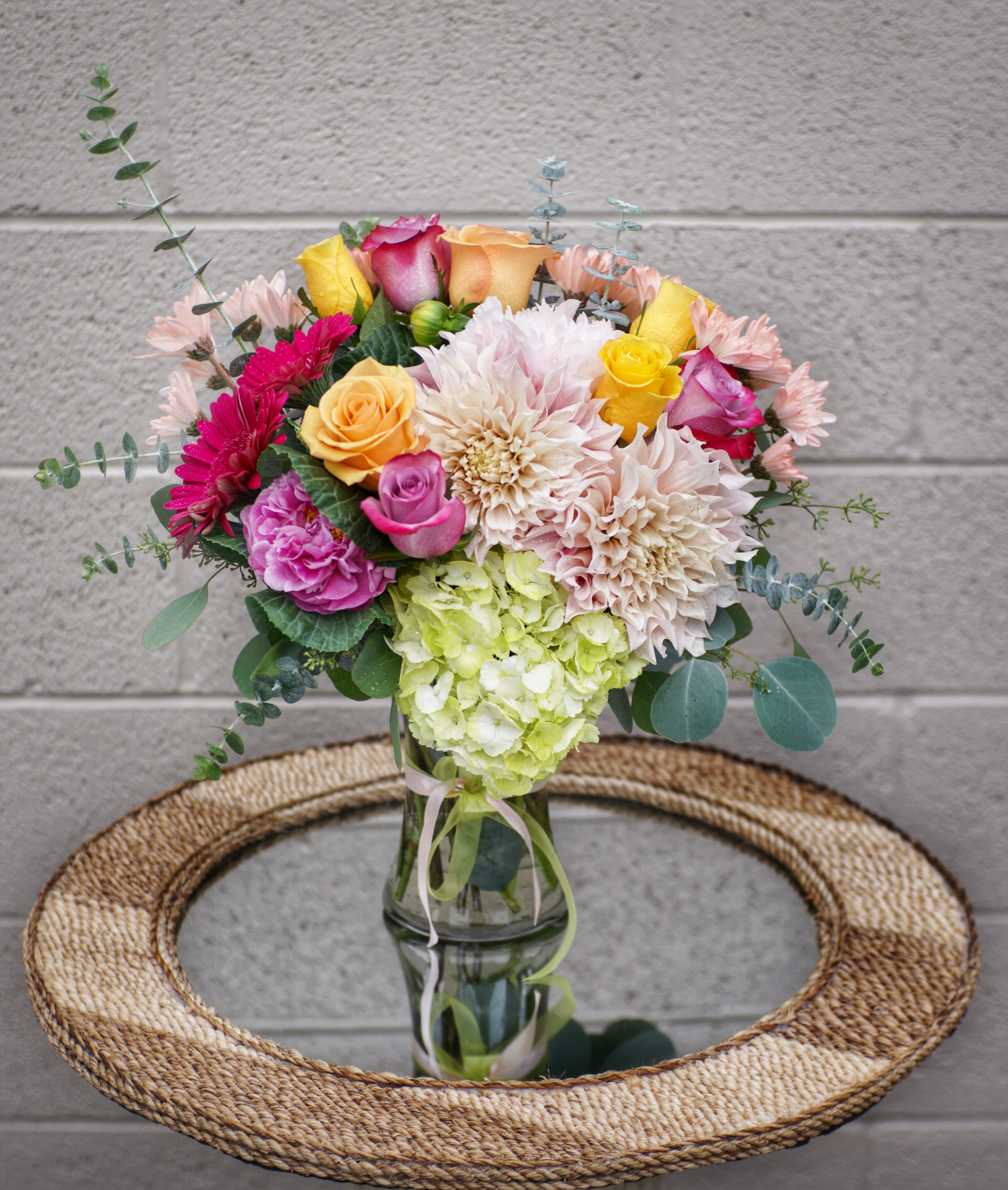 La Mode - Lovely design including all premium fresh flowers: dahlia (SEASONAL), gerbera, rose, hydrangea... with accents in a glass vase. Dimension: 15&quot; H x 10&quot; L  STANDARD: FIRST PHOTO DELUXE: SECOND PHOTO PREMIUM: THIRD PHOTO