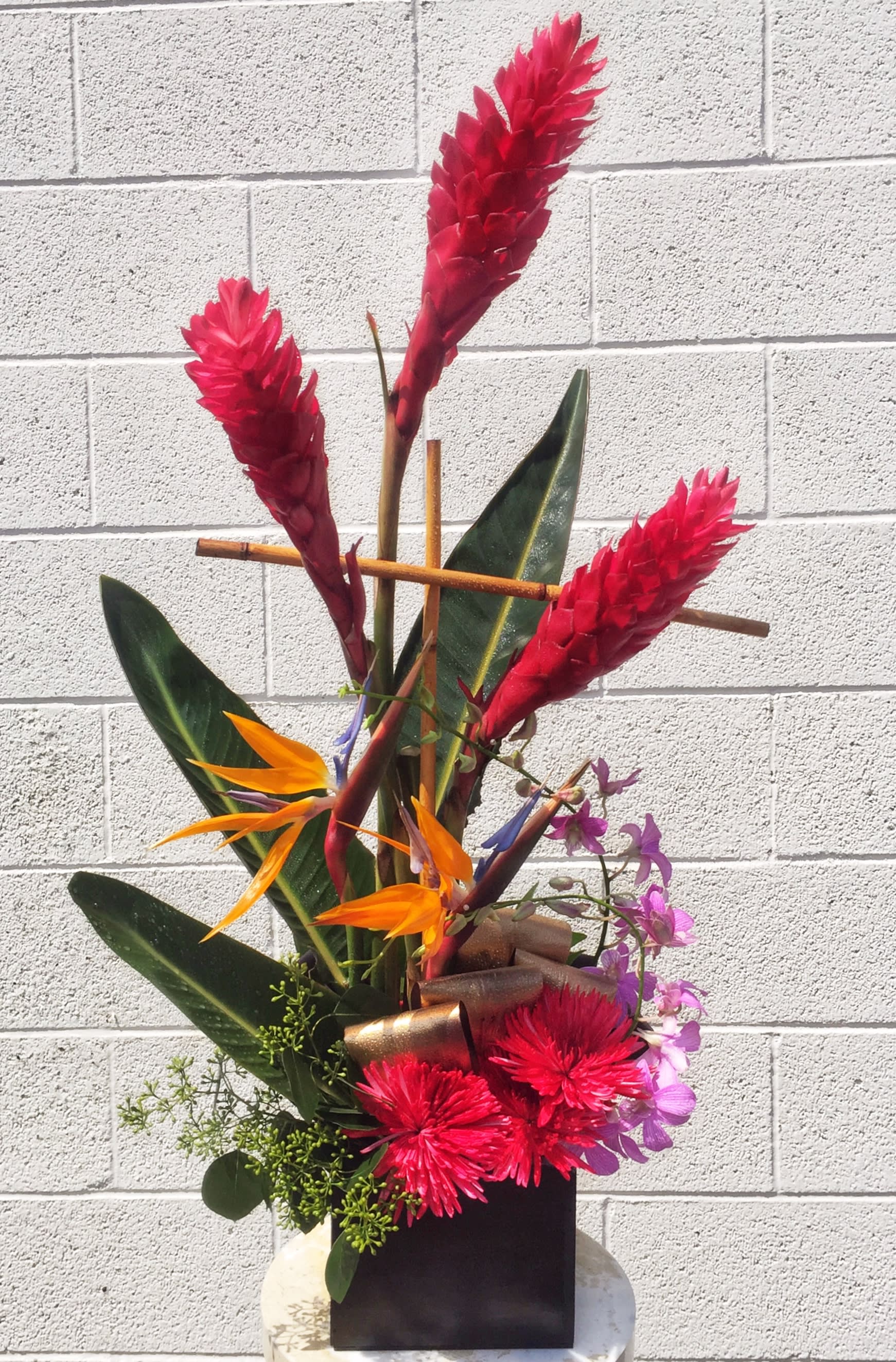 Flamingo Tango - Tropical design including red ginger, protea, birds of paradise, orchid and nice accents. Dimensions: 30&quot; H x 15&quot; W STANDARD: FIRST PHOTO DELUXE: SECOND PHOTO