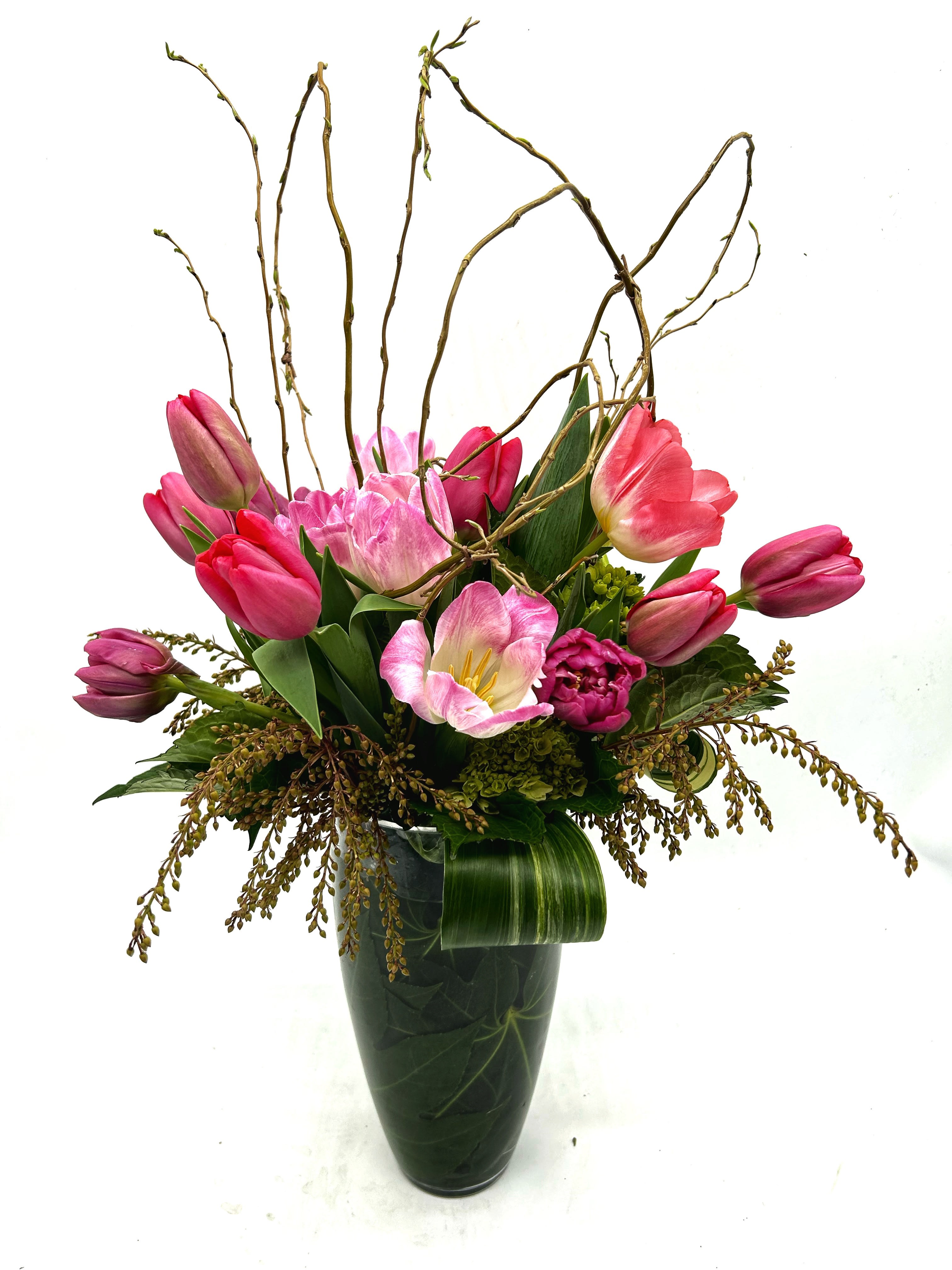 Treasured Tulips  - All tulips with curly willow and greenery. Lush mix of 15 tulips in shades of purple and pink.