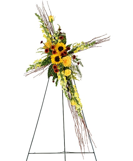 Glorious Life Spray - Highlight the warmth and love of those you've lost with this beautiful birch branch cross, filled with sunflowers, yellow snapdragons, button poms and roses, and solidago.