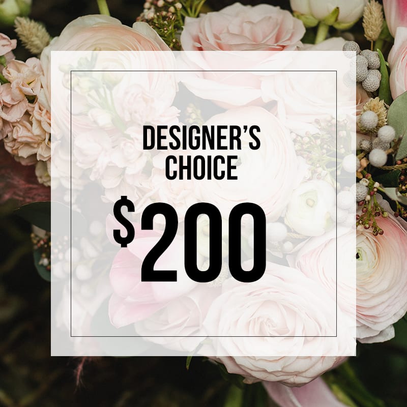 Designer's Choice 200 - Let us create a beautiful arrangement with the freshest seasonal flowers that are sure to put a smile on someone's face.   You can add a note with color preferences and we will do our best to accommodate. 