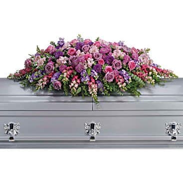 Lavender Casket Spray - For the Service Lavender Casket Spray - For the Service - Honor her femininity and generous spirit with a blanket of sweetly scented lavender, pink and purple flowers that create a magnificent final tribute, sincerely expressing devotion and love. Gorgeous flowers such as lavender and pink roses, pink snapdragons and alstroemeria, purple and lavender chrysanthemums.