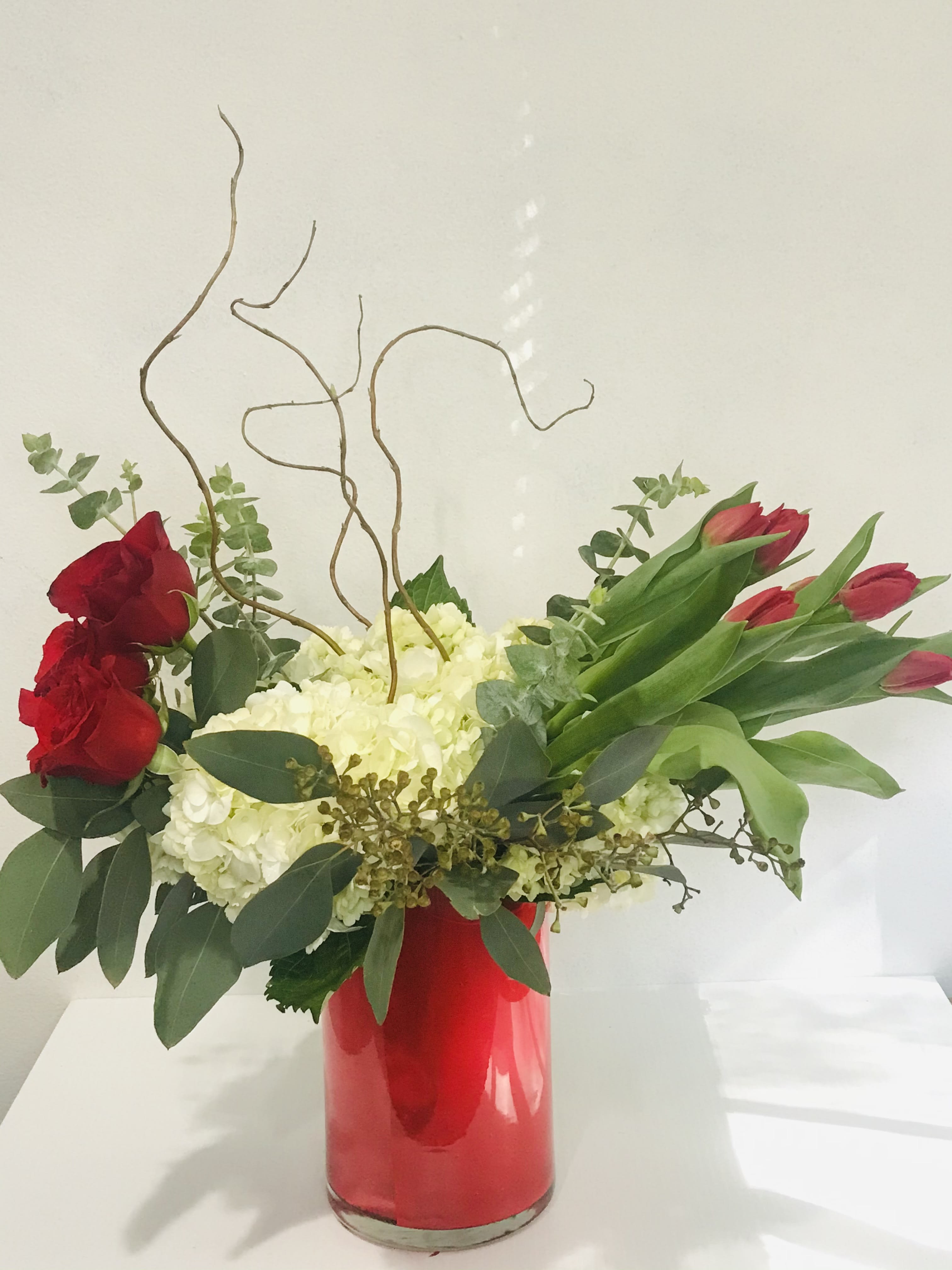 Elegance  - An elegant arrangement of tulips, hydrangeas and roses carefully arranged to show just how much they mean to you. 