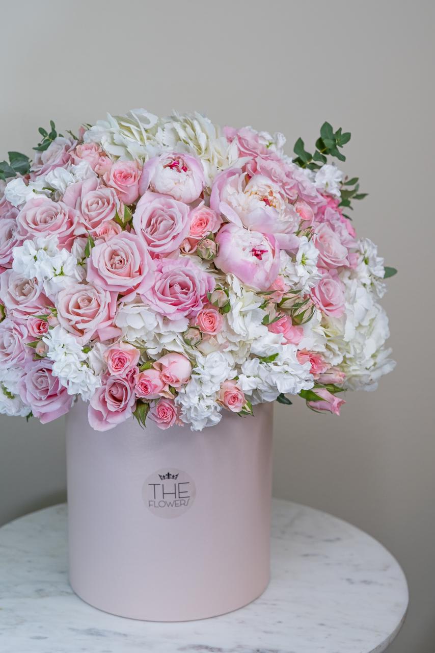 Pink Petals Love - An incredibly soft and delicate combination of pink peonies, roses,  hydrangeas, and the southern aroma of California make this flower box so attractive. It is aimed to brighten events and memorable meetings