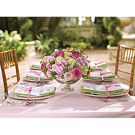 Garden Rhapsody Centerpiece - Bridal shower? Baby shower? Afternoon wedding? Add an elegantly girly touch to any of them with this stylish mix of pinks and greens. Presented in a classic Mercury Glass Vase it's where trendy meets traditional! Pink hydrangea light pink and pink roses green carnations ming fern and bupleurum are artfully arranged in a Mercury Glass Bowl.  The bouquet pictured reflects our original design for this product. While we always try to follow the color palette, we may replace stems to deliver the freshest bouquet possible, and we may sometimes need to use a different vase. 