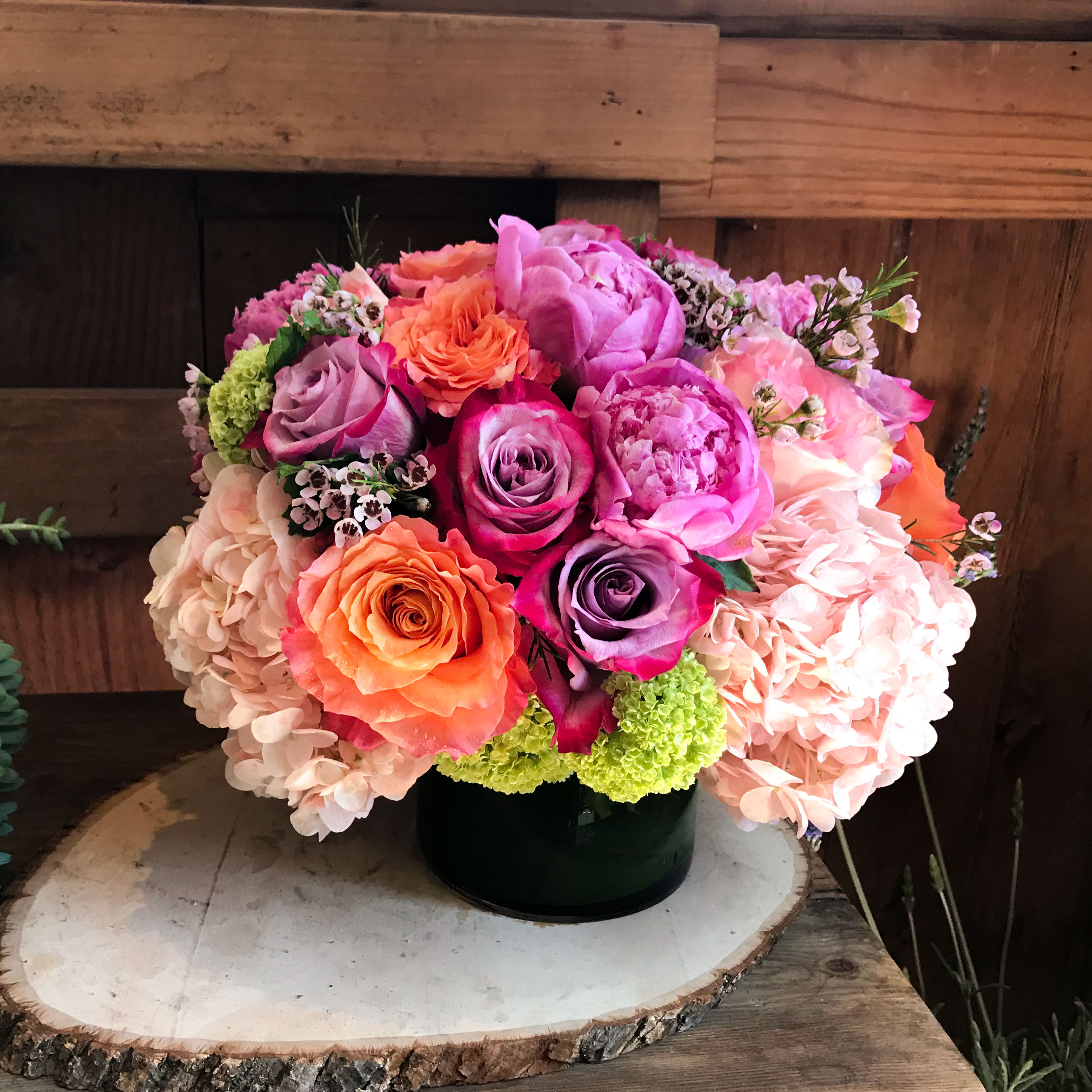 Sweet Romance - Send something sweet without counting calories.  This unforgettable arrangement has lavender and orange roses, pink peonies and hydrangeas, viburnum and wax flowers in a 7&quot; wide x 10&quot; tall ensemble. &quot;Sweet Romance&quot; doesn't need a holiday for anyone to enjoy all year.