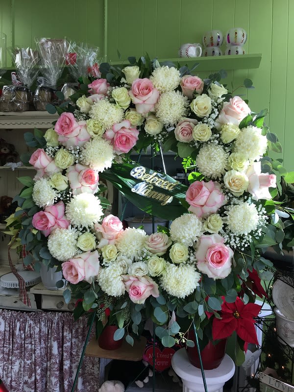 Peace Eternal Wreath Peace Eternal Wreath - A breathtaking expression of love and devotion, this lovely wreath delivers a message that is both subtle and strong. Its soft pastel blossoms will soothe, while its extraordinary beauty will express the depth of your emotions.