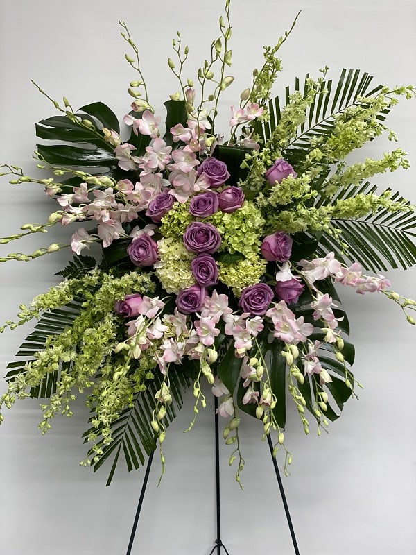 Our Heavenly Sentiments Spray Our Heavenly Sentiments Spray - Fresh roses and opulent blooms such as orchids and gladioli - in celestial colors of green, purple and lavender - create a fine and appropriate floral standing spray. Send this gift as a representation of your thoughtfulness and devotion.