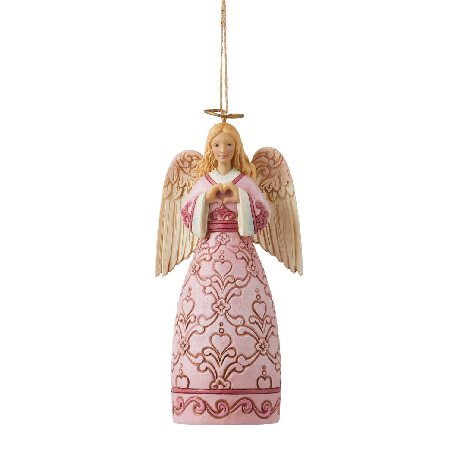 Jim Shore - Rose Pink Angel Ornament - n support of The Rose Center for Breast Health Excellence, this Jim Shore angel ornament is built in the image of hope. Inspired by the women in his life, Jim Shore creates an awareness angel befitting of heroines. Honor them every Christmas.  Hanging Ornament 4.92in H A portion of the proceeds from this Jim Shore Heartwood Creek Ornament benefit The Rose. Beautifully hand-painted and crafted with intricate styling and attention to detail Jim Shore's unmistakable style evokes a sense of nostalgia with traditional themes, quilt patterns and design motifs inspired by American and European Packaged in individual box with photo on front Designed by Award Winning Artist Jim Shore