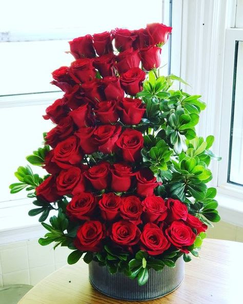 Red Corvette Red Corvette - Slick, modern take on bouquet of red roses.