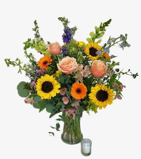 Most Memorable Tribute (for home or office) - Our popular &quot;Most Memorable Tribute&quot; designed in a vase for an all around style, appropriate for delivery to a home or office. A clear glass vase filled with vibrant seasonal flowers to offer your condolences in a most memorable way. 
