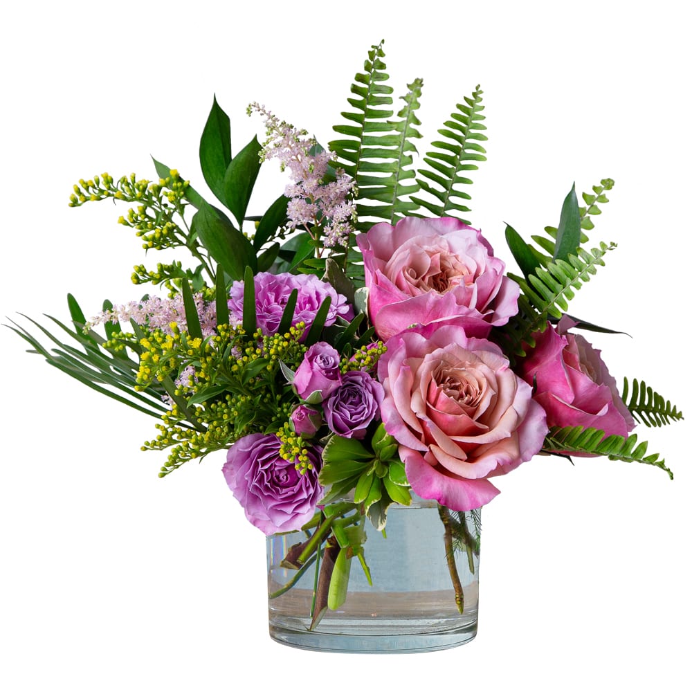 Blooming Spring - TMF-1540 - A beautiful petite arrangement in shades of pinks, lavender and yellow featuring blooms like garden roses, spray roses, astilbe and solidago with Florida foliage of pittosporum, ruscus, sword fern, and coontie designed in a cylinder appropriate for an end table. Approximately 13&quot;W X 12&quot;H
