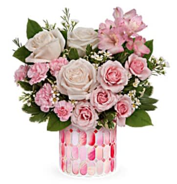 Sweet Clouds - Celebrate a special day with this sweet treat of radiant roses in a keepsake mosaic vase of candy-pink stained glass. Crème roses, pink spray roses, pink alstroemeria, miniature pink carnations and white waxflower are arranged with lemon leaf and green pittosporum. Delivered in Teleflora's Precious in Pink Cylinder.