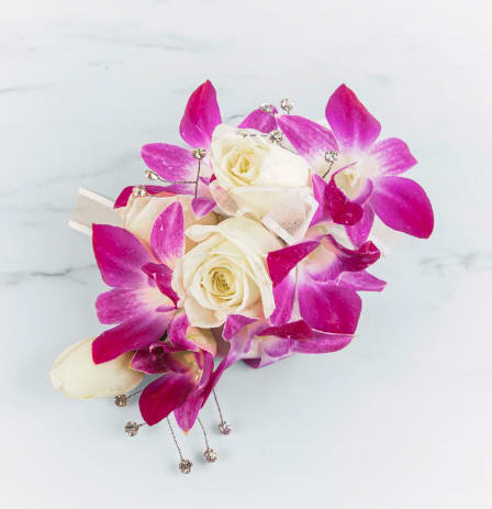 Orchid Corsage by BloomNation™ Orchid Corsage by BloomNation™ - This orchid corsage with a white rose and gem accent will catch the light and compliment any dress. Perfect for prom, formal or any wedding event.