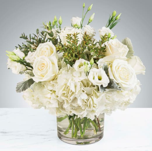 Cloud Nine by BloomNation™ Cloud Nine by BloomNation™ - New beginnings deserve flowers! This all white arrangement includes roses, lisianthus and hydrangeas. Cloud Nine by BloomNation™ is the perfect gift for celebrating a new year, a new baby, or a newly married couple. APPROXIMATE DIMENSIONS 15" W X 13" H