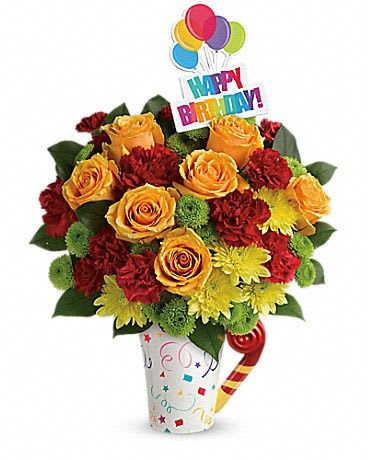 Fun 'n Festive Bouquet - A celebration in a mug! Make a special day even more memorable with this bright, beautiful gift. Radiant orange roses and rich red carnations burst with happiness from a festive mug they'll love sipping from for years to come!      Light orange roses, red carnations, green button spray chrysanthemums and yellow cushion spray chrysanthemums are arranged with fresh lemon leaf.     Delivered in Teleflora's Cheers To You mug.     Orientation: One-Sided     All prices in USD ($)