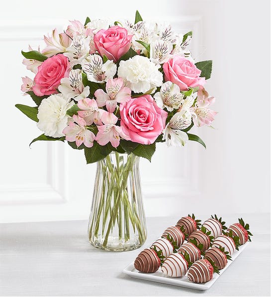  Cherished Blooms &amp; Drizzled Strawberries - Celebrate someone special with a gift pairing full of sentiment and sweetness. We’ve brought together a lovely pink and white bouquet with our decadent Gourmet Drizzled Strawberries™ to remind them how much they’re cherished.  Flowers:  Mixed bouquet of pink roses, white carnations, and pink &amp; white Peruvian lilies (alstroemeria) Picked fresh on our premier farms around the world, our flowers are cared for every step of the way and shipped fresh to ensure lasting beauty and enjoyment Vase available in select areas only Berries:  12-count box of Gourmet Drizzled Strawberries™ dipped in milk chocolaty confection with milk chocolaty drizzle; dipped in milk chocolaty confection with white chocolaty drizzle; dipped in white chocolaty confection with milk chocolaty drizzle May be delivered from a local shop or shipped in a gift box  Serves approx. 2-4 people; serving size 140 grams May Contain: Milk &amp; Soy. For additional allergy information,