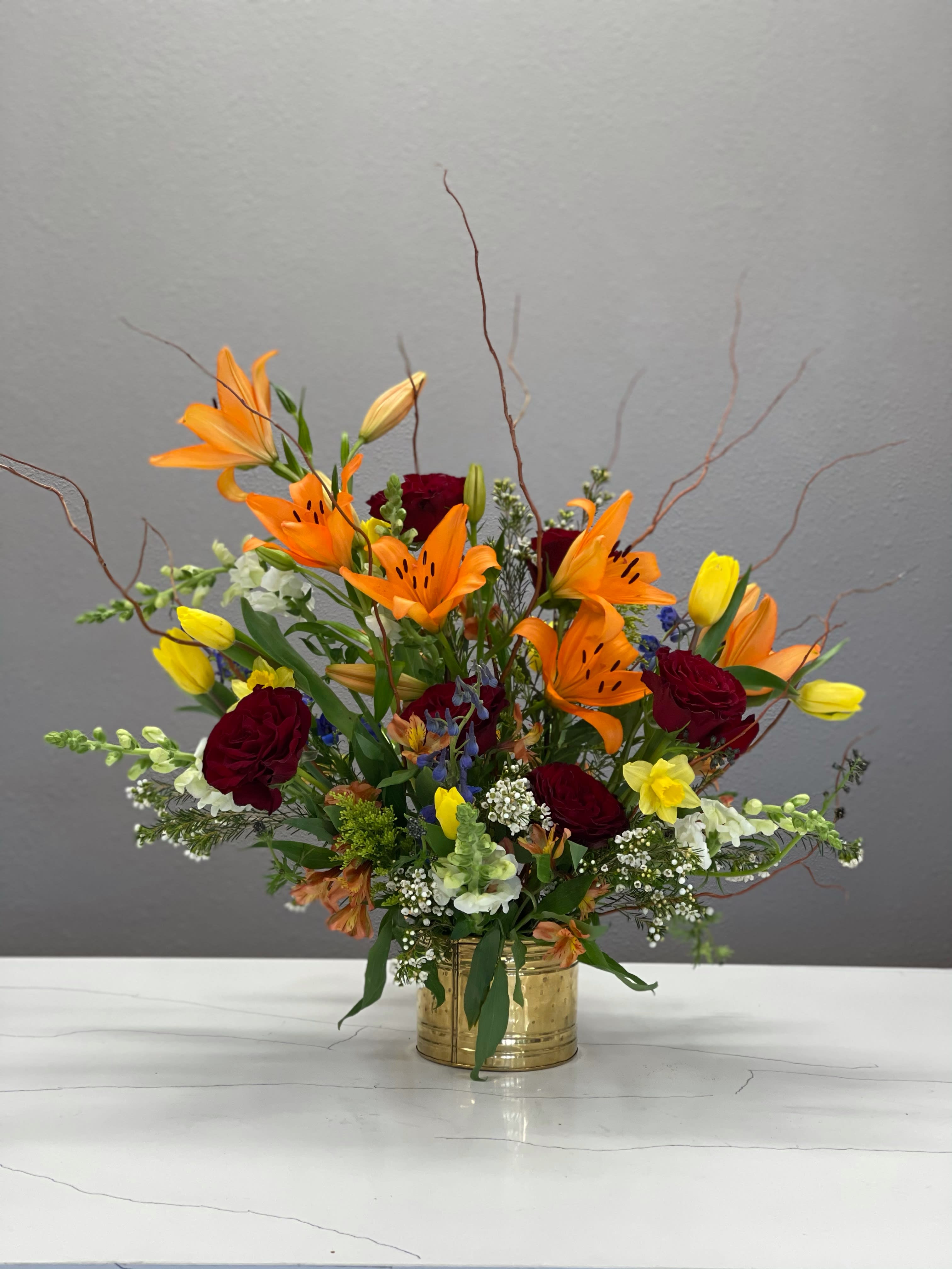 Moody Springtime - This drama queen is all about the springtime blooms but can't let go of her moody vibes- peppered with burgundy roses she's ready to welcome in the new season, but only on her terms. 