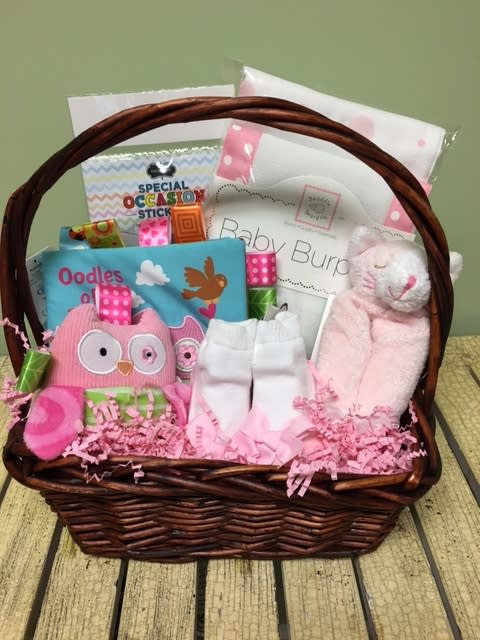 Welcome Baby Girl GS02 - Welcome your new little lady with this gift filled with unique baby specialty items from our children's boutique. Gifts will be chosen with care by our Rhoads Buds crew. Items may vary based on availability. Local deliveries only.