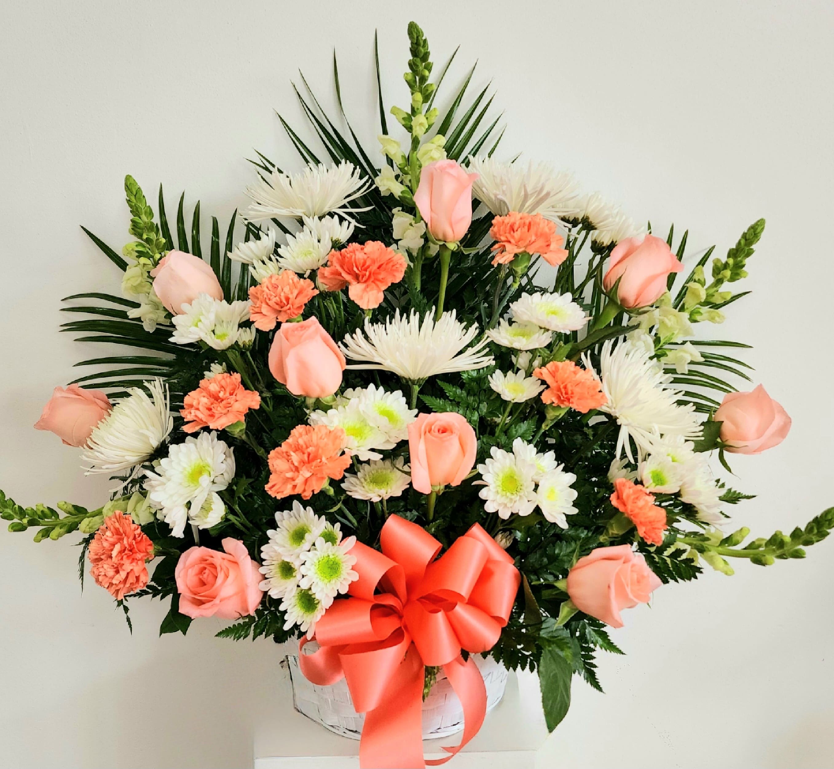 Peach Sympathy Basket - Peach roses, orange carnations, white snap dragon with spider mums. This is a Sympathy basket that the family will want to take home to enjoy.